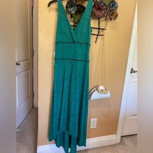 76. Sleeveless dress is a size small polyester and rayon.